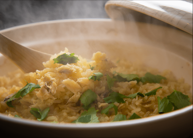 A cooked rice in a pot using seasonal ingredients